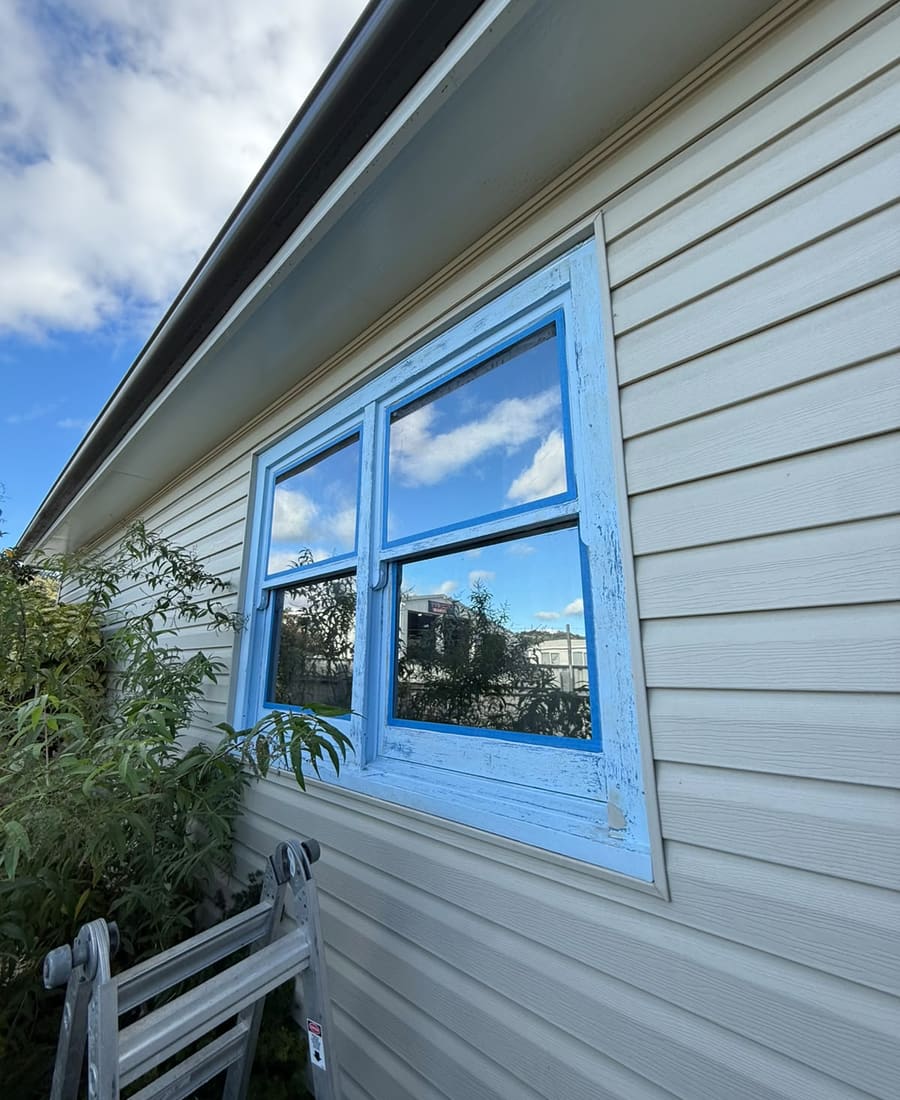 Window frame before: flaking, weathered paint